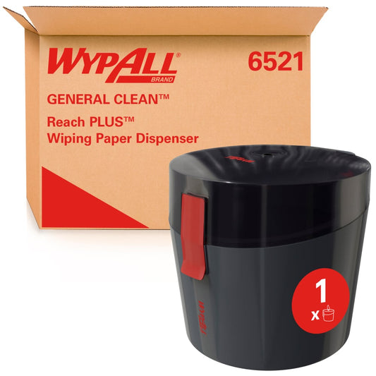 Ein Karton mit der Aufschrift "WypAll® Reach Plus™ Centrefeed Dispenser - 1 Dispenser | Karton (1 Spender)" der Kimberly-Clark GmbH steht hinter einem schwarzen WypAll-Spender mit rotem Verschluss und "1 x"-Anzeige auf der Vorderseite.