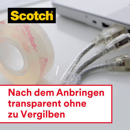 Eine Rolle Scotch® Crystal Klebeband (19 mm x 25 m) der 3M Deutschland GmbH liegt neben einem Laptop und zwei Kabeln. In einem Textfeld steht: "Nach dem Anbringen transparent ohne zu Vergilben.