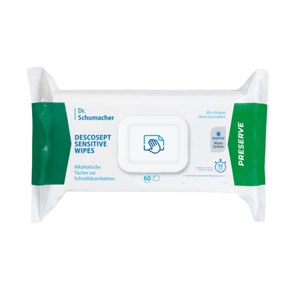 Un paquet de lingettes désinfectantes « Dr. Schumacher Descosept Sensitive Wipes » de la société Dr. Schumacher GmbH, destinées à une désinfection rapide. L'étiquette précise qu'il s'agit de lingettes à base d'alcool, idéales pour les surfaces de taille moyenne. Le paquet est principalement blanc avec des touches de vert et contient 60 lingettes.