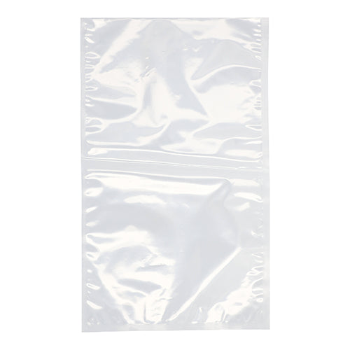Un PAPSTAR sachet à souder 100, PA/PE transparent, de la PAPSTAR GmbH, est présenté à plat et non scellé sur un fond blanc. Le sac en plastique transparent, idéal pour le stockage des aliments, présente de légers plis et une couture centrale.