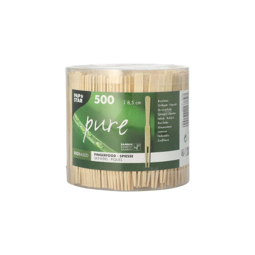 Le conteneur en plastique transparent de la PAPSTAR GmbH contient 500 "brochettes de finger food pure" (8,5 cm), parfaites pour les snacks. L'étiquette "pure" verte et blanche montre des informations sur le produit et le branding - brochettes en bois idéales pour vos besoins en accessoires de fête.