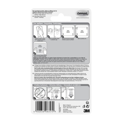 Verso d'un paquet de bandes adhésives Command™ Poster-Strips 17024 de 3M Deutschland GmbH avec des instructions illustrées étape par étape pour une fixation sans résidus et pour fixer des posters en plusieurs langues, avec des diagrammes, un code-barres et le marquage 3M en bas à droite.