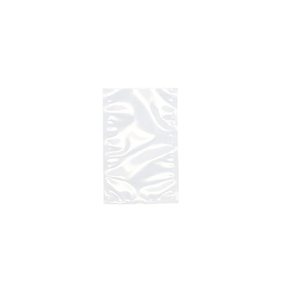 Un sachet à souder Starpak 100 transparent, PA/PE de Starpak est non scellé devant un fond blanc. Le sac en plastique brillant, rectangulaire avec des plis visibles et des réflexions, est idéal pour une utilisation avec une machine à vide à cloche.