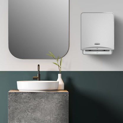 Modernes Badezimmer mit rechteckigem Spiegel, rundem Waschbecken auf Beton, schwarzem Wasserhahn, weißer Vase mit grünen Stielen und einem Kimberly-Clark Professional™ Icon™ Elektronische No Touch - Silver Mosaic Handtuchspender an der Wand.