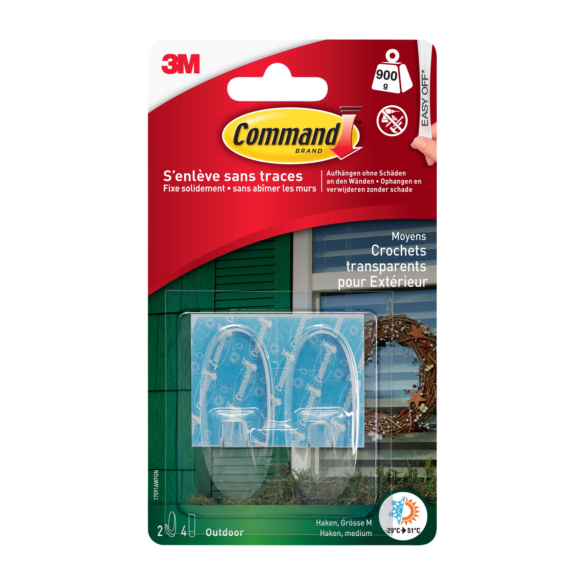 Eine Packung 3M Deutschland GmbH Command™ transparente mittelgroße Outdoor-Haken in ovaler Form (17091AW), einzeln verpackt, sichtbar im Kunststoffgehäuse vor grün-weißem Hintergrund.