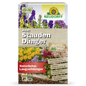 Eine Schachtel mit Neudorff Shop Azet StaudenDünger, einem organischen Dünger für Gärten und Stauden, mit bunten Blumen und deutschen Produktinformationen auf der Vorderseite.