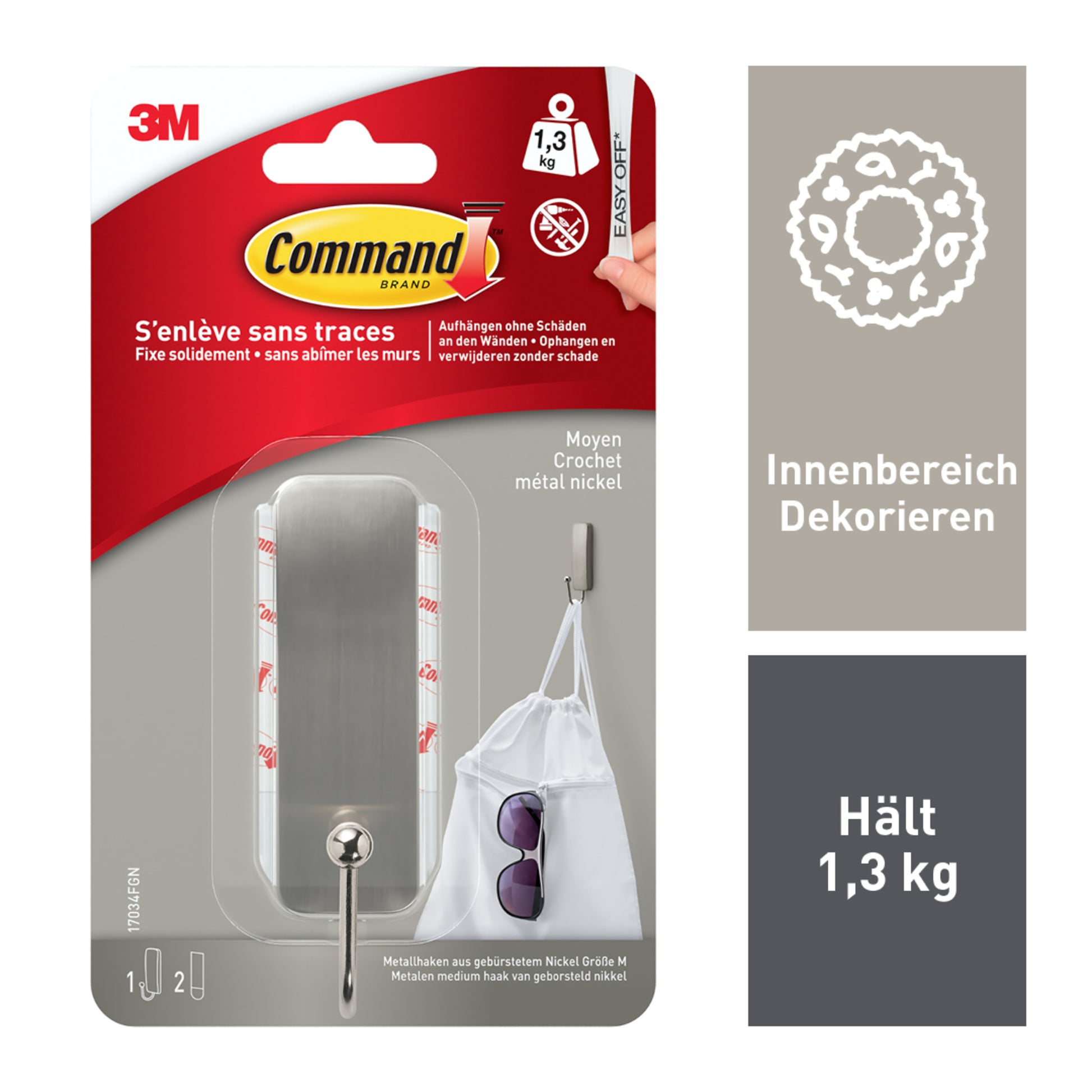 Ein 3M Command™ Mittelgroßer Metallhaken in gebürstetem Nickel (17034), Verpackung mit 1 Haken & 2 Strips, bis zu 1,3 kg Tragkraft. Die Packung zeigt Anwendung für Taschen & Sonnenbrillen und informiert auf Deutsch über Nutzung im Innenbereich.