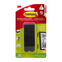 Un paquet de grandes bandes adhésives noires Command™ pour accrocher des tableaux (réf. 17206BLK) de la société 3M Deutschland GmbH, permettant d'accrocher sans abîmer les murs des cadres pouvant peser jusqu'à 7,2 kg, avec des instructions en français et des illustrations pour une utilisation facile.