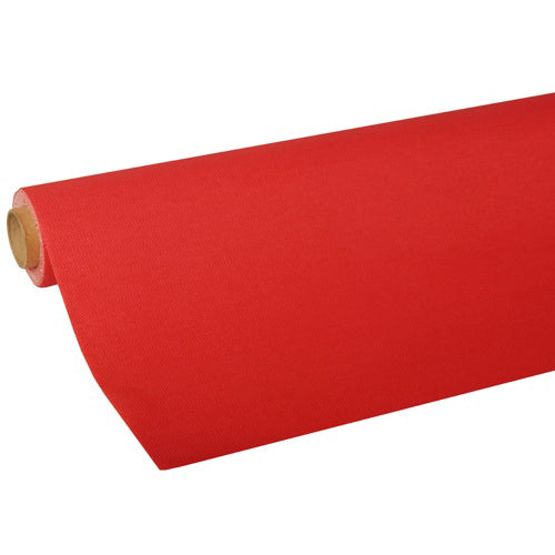 Une nappe PAPSTAR partiellement déroulée de la collection ROYAL de PAPSTAR GmbH montre un papier de soie rouge lisse et ferme de haute qualité, soigneusement enroulé autour d'un tube en carton.