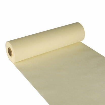 De Starpak tafelloper, stofachtig vlies „soft selection“ (24 m x 40 cm), in zachtgeel is hier gedeeltelijk uitgerold met zichtbare binnenbuis afgebeeld – perfect als elegante tafelloper voor stijlvolle omgevingen.