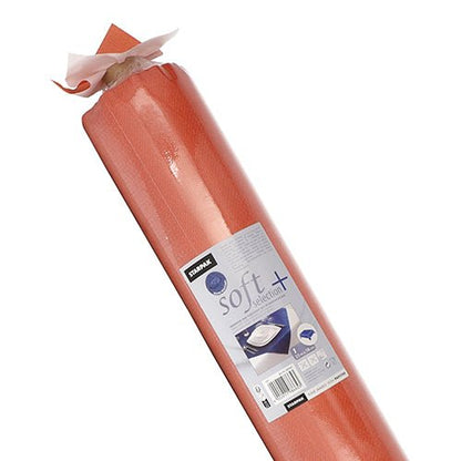 Un rouleau de nappe Starpak, ressemblant à du tissu, non-tissé "soft selection plus" papier médical avec une étiquette centrale avec la marque Starpak, des instructions d'utilisation et l'image d'une table d'examen recouverte de papier, mettant en valeur la qualité de la nappe durable.