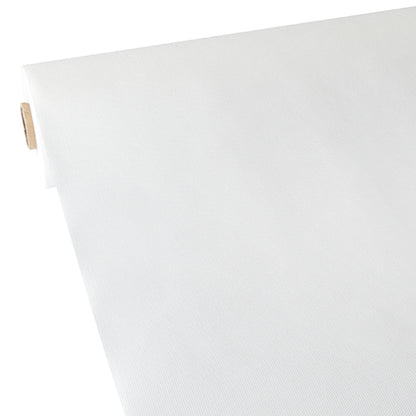 Un gros plan de la nappe Starpak, semblable à du tissu, en non-tissé « soft selection » (40 m x 0,9 m, blanc), montrant le rouleau avec un noyau en carton déroulé en biais - idéal pour les travaux manuels ou comme nappe moderne.