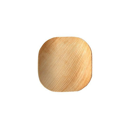 La PAPSTAR 25 assiette en feuille de palmier « pur » de la PAPSTAR GmbH est une petite assiette carrée avec des bords arrondis en feuille de palmier clair. Son design écologique se distingue par son grain naturel unique et est présenté sur un fond blanc simple.