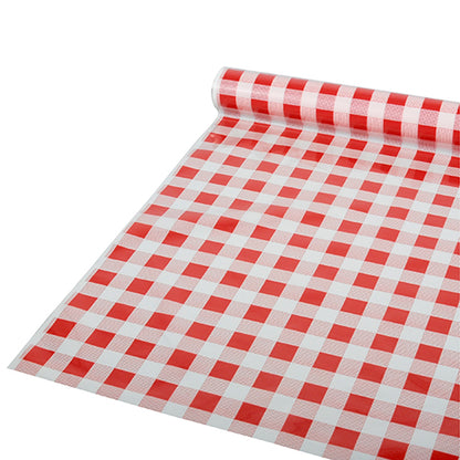 Sur une surface plane, une nappe Starpak partiellement déroulée, film 50 m x 80 cm rouge « Karo » (1 rouleau), avec un motif à carreaux rouge et blanc est représentée ; le matériau semble être un film plastique.