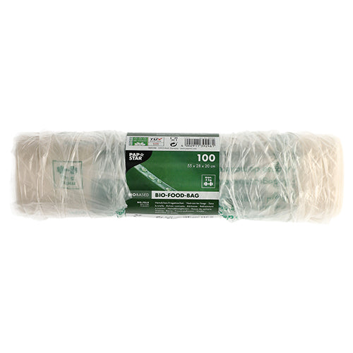 Een rol met 100 PAPSTAR hemdtasjes van transparante bio-folie (knooptasjes) is verpakt in folie en draagt een groen en wit etiket met productdetails en milieuvriendelijke symbolen.