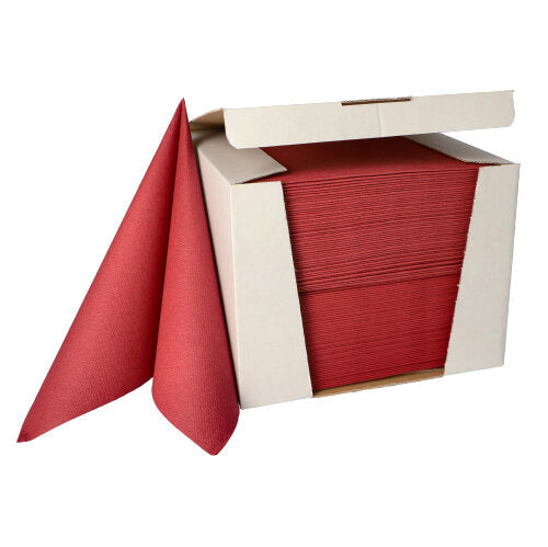 Une pile de PAPSTAR 100 serviettes "ROYAL Collection" 1/4-pli 40 cm x 40 cm de la PAPSTAR GmbH est partiellement tirée d'une boîte distributrice blanche ouverte.