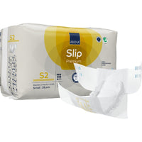 Une boîte de culottes ABENA Slip Premium de la société Abena Re-Seller GmbH, taille small (28 pièces), avec le logo bien visible et une culotte dépliée à côté de la boîte.