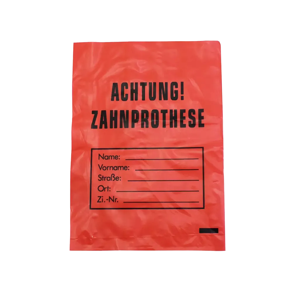 De AMPri LDPE gebitsprothesezak met de afmetingen 17 x 24 cm heeft een rood ontwerp met zwarte "LET OP! GEBITSPROTHESE"-tekst en velden voor naam, adres en kamernummer, om een hygiënische en eenvoudige identificatie van gebitsprothesen te waarborgen. Merk: AMPri Handelsgesellschaft mbH.