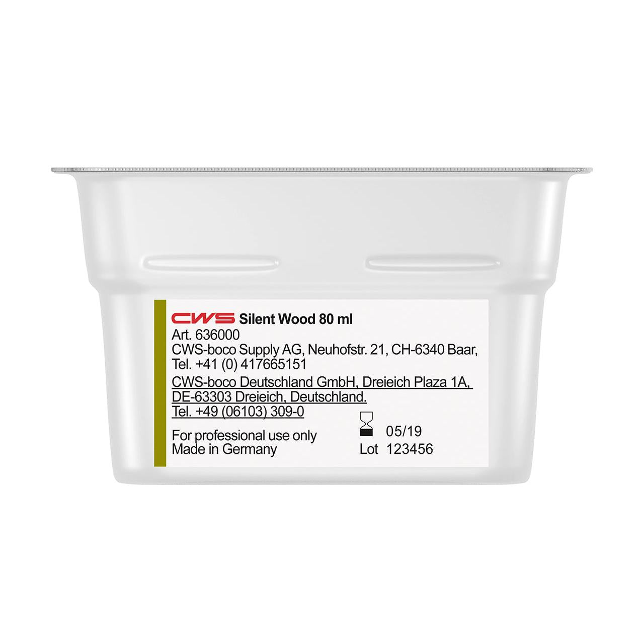 Gros plan d'un conteneur CWS ParadiseLine Parfum pour salle de bain pour diffuseur de parfum Paradise Air Bar avec les informations du fabricant, les coordonnées, le numéro de lot et la date d'expiration sur l'étiquette. Uniquement pour un usage professionnel.