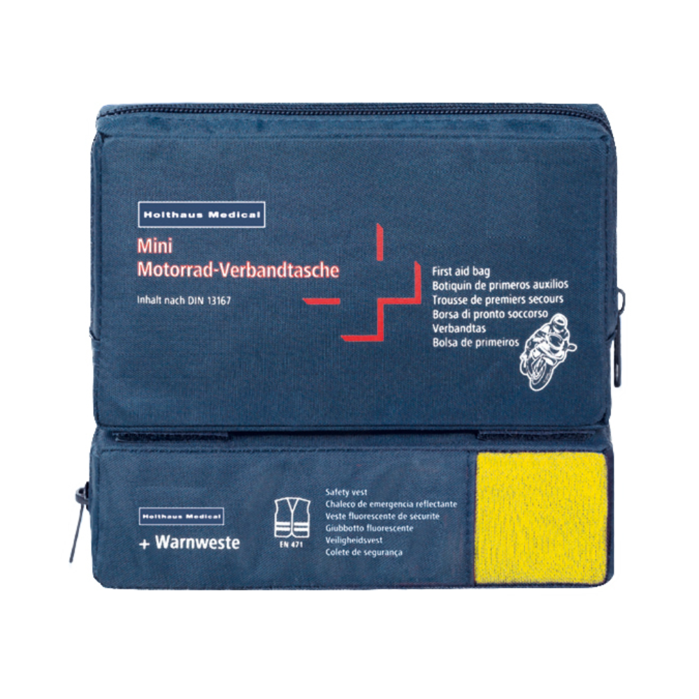 Een blauwe EHBO-set met het opschrift „Holthaus Mini Combi Verbandtasche Motorrad“ van Holthaus Medical GmbH & Co. KG met meertalige tekst voor motorfietsen. Het voldoet aan de DIN 13167 en bevat een door een transparant gedeelte zichtbare veiligheidsvest. De Mini Combi Verbandtasche heeft twee ritsvakken – een bovenaan en een aan de zijkant.