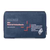 Une trousse de premiers secours bleu foncé portant l'inscription « Holthaus Mini Motorrad Verbandtasche DIN 13 16 » en lettres blanches et rouges. La trousse comporte également une petite illustration de moto et contient des étiquettes multilingues indiquant qu’il s’agit d’un kit de premiers secours conforme à la norme DIN 13167, fabriqué par Holthaus Medical GmbH & Co. KG.