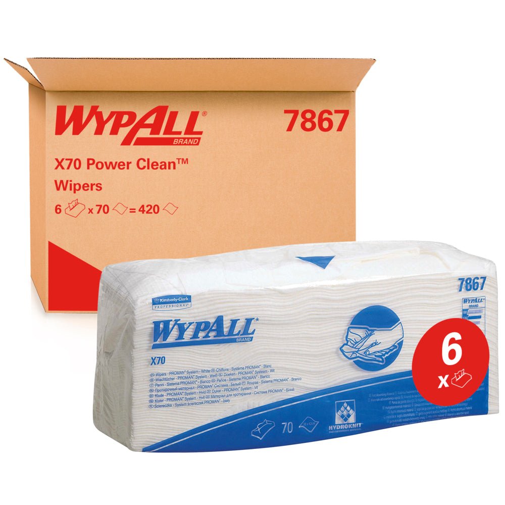 Un paquet de lingettes WypAll® X70 - pliées / blanc (6 sacs x 70 lingettes) de Kimberly-Clark GmbH est représenté devant un carton portant l'inscription "WypAll 7867". L'étiquette rouge "6x" met en valeur les lingettes de nettoyage de qualité industrielle avec un marquage bleu.