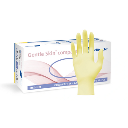 Exposée, une boîte de gants médicaux de taille moyenne, sans poudre, Meditrade Gentle Skin® Latexhandschuhe compact+ jetables, avec un gant jaune en latex jetable étendu devant.