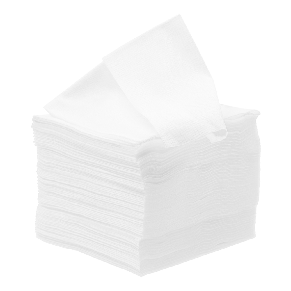 Une pile de serviettes blanches soigneusement pliées de Meditrade GmbH, une partiellement retirée, isolée sur un fond blanc.