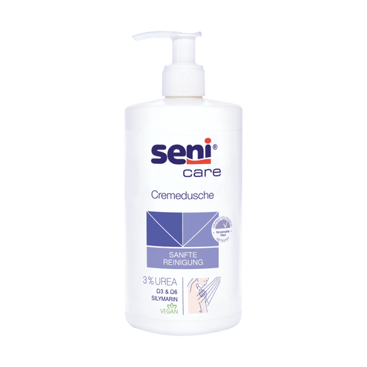 De Seni Care Crèmedouche van TZMO Deutschland GmbH, 500 ml, bevat 3% ureum, silymarine en een veganistische formule. De witte fles is voorzien van een pompdispenser en is voorzien van de blauwe tekst „ZACHTE REINIGING“, ideaal voor de droge huid.