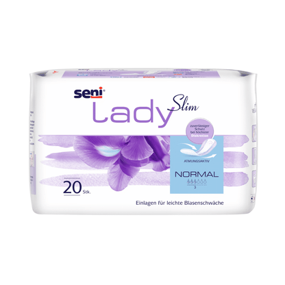 Un paquet de 20 protège-slips Seni Lady Slim Normal de TZMO Deutschland GmbH se présente dans un emballage blanc-violet avec un motif floral, des détails du produit en allemand et un arrêt d'odeur pour une légère faiblesse vésicale.