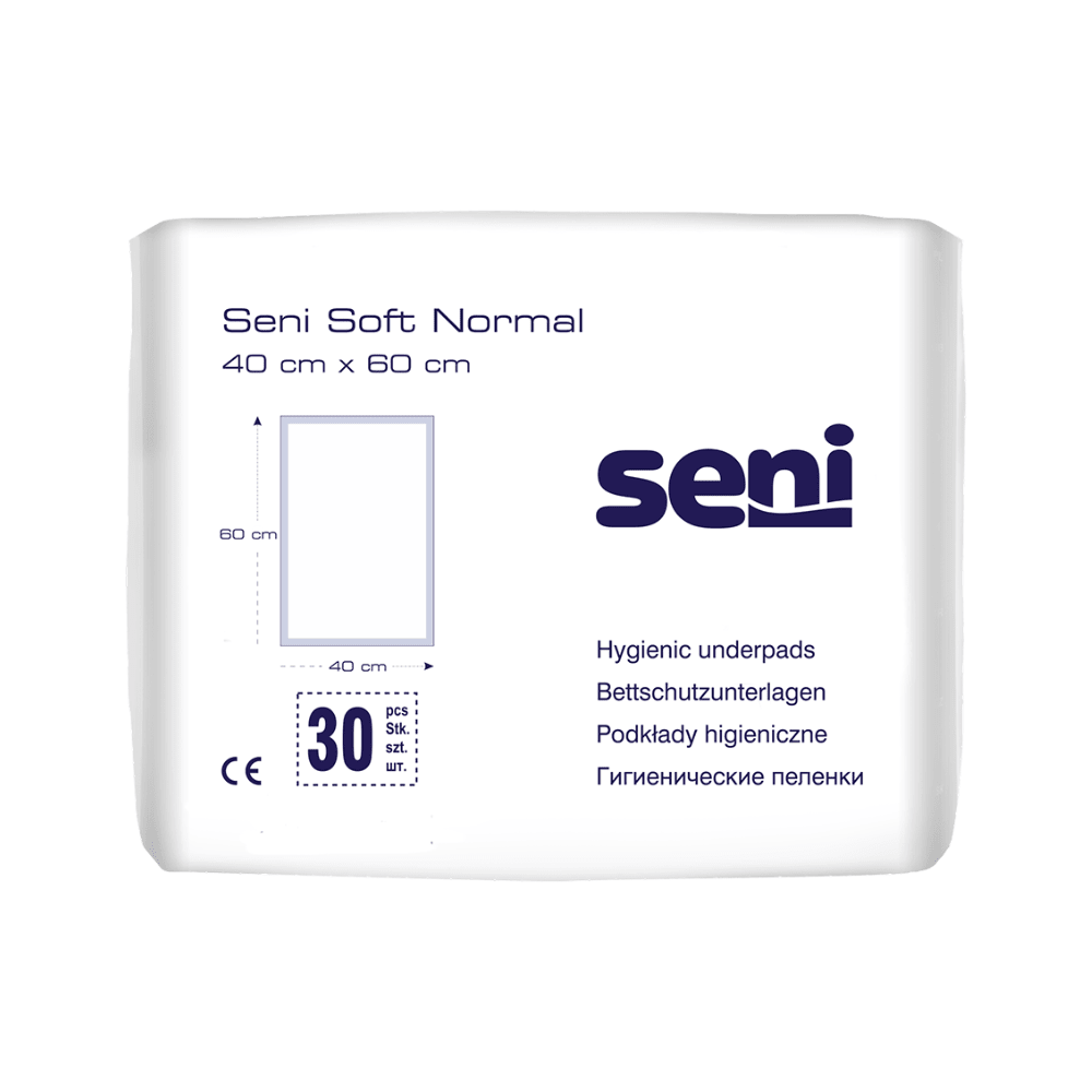 Un paquet de protections de lit Seni Soft Normal de TZMO Deutschland GmbH (40 x 60 cm). L'emballage blanc avec du texte bleu et des graphiques contient 30 pièces et offre une protection fiable et des informations en plusieurs langues.