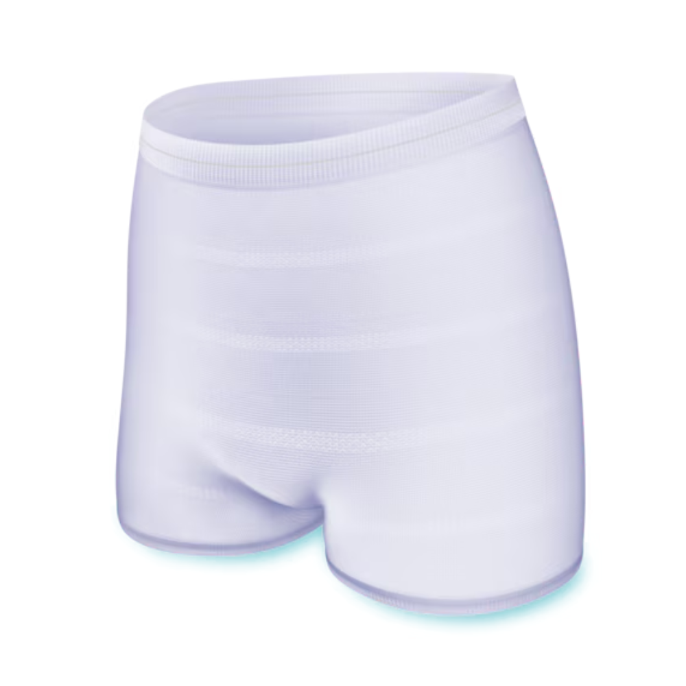 L'image montre une culotte de fixation pour incontinence TENA Fix blanche et sans couture de TENA – Essity Germany GmbH avec une ceinture ajustée. Le tissu lisse et légèrement réfléchissant suggère qu'il est extensible et confortable, ce qui le rend idéal pour les culottes de fixation pour incontinence. La culotte se distingue par un design clair et minimaliste.