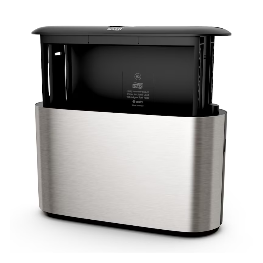 Nous présentons le distributeur de table Tork Xpress® 460005, un distributeur automatique élégant en acier inoxydable au design moderne, idéal pour les serviettes multifold. Ce produit de TORK – Essity Professional Hygiene Germany GmbH dispose d'un dessus noir avec un capteur visible au centre et des ouvertures latérales pour une distribution facile des serviettes.