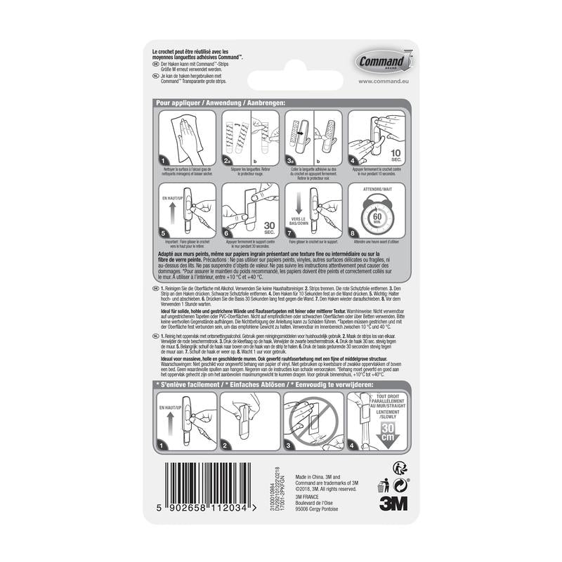 Au dos du moyen crochet polyvalent Command™ M pack avantage (17001-2) de 3M Deutschland GmbH se trouvent des étapes de montage illustrées, des avertissements multilingues, un code-barres, des informations sur le fabricant et le logo 3M en bas à droite.